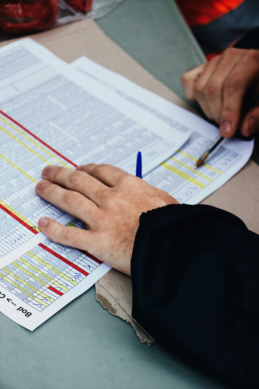 about-01 persons-hand-on-two-stack-of-paper-a7bbjzmdqk4